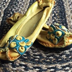 Yellow/gold leather slip ons